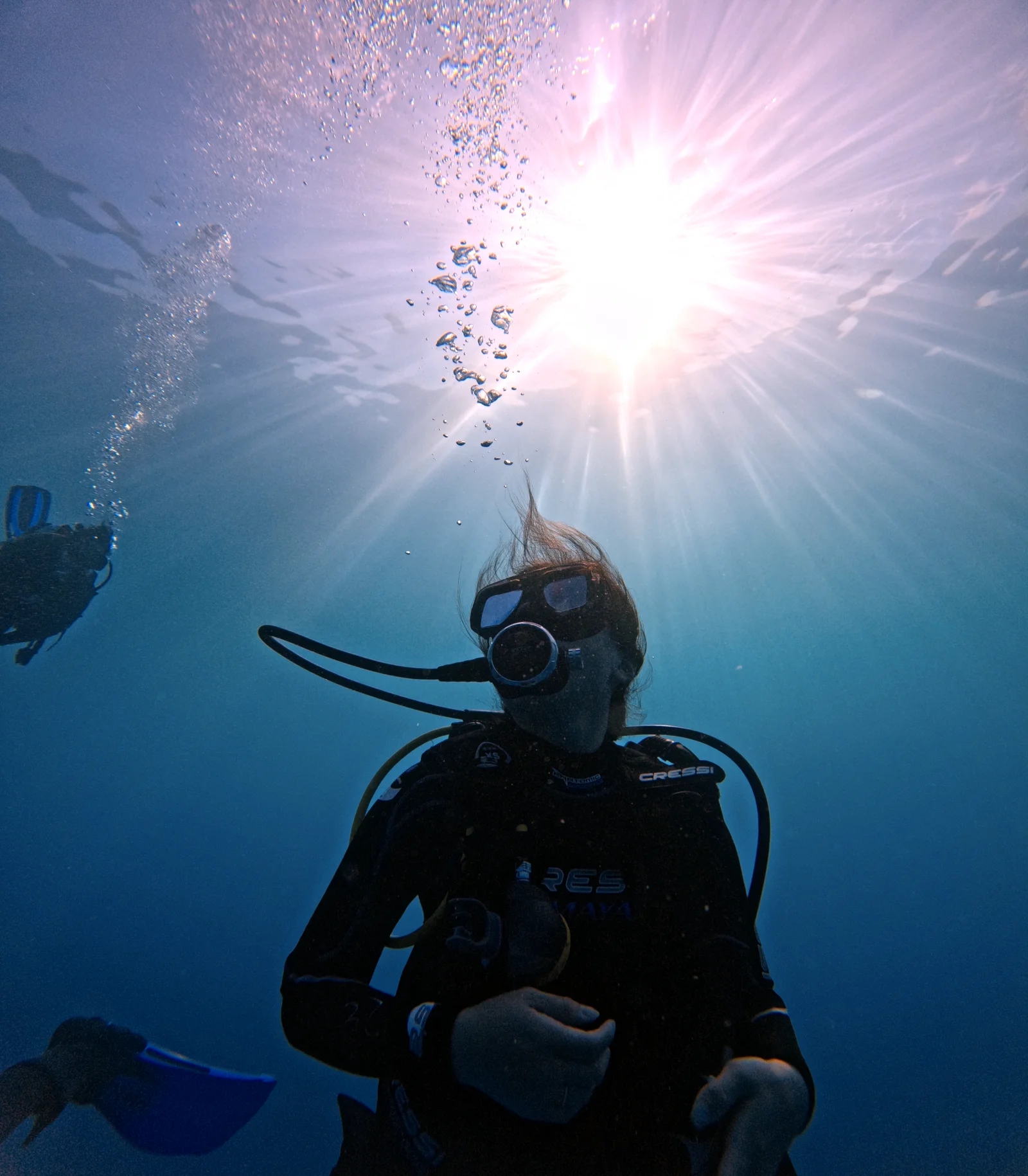Open Water student silhouetted against the sun off Cancun