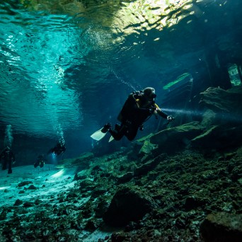 a man that is standing in the water