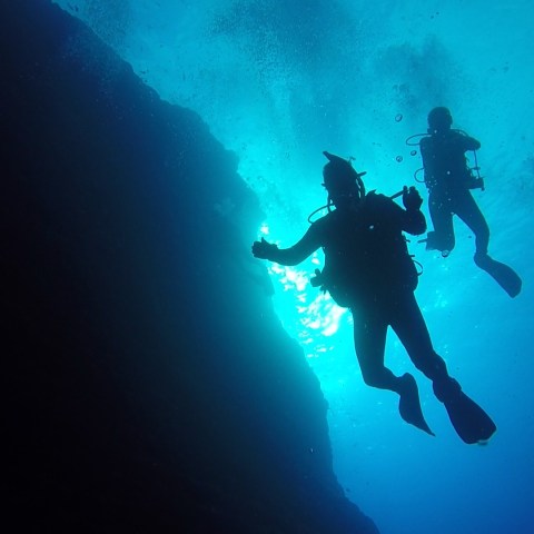 a person riding a surf board in the dark