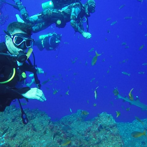 a motorcycle parked on the side of a swimming pool
